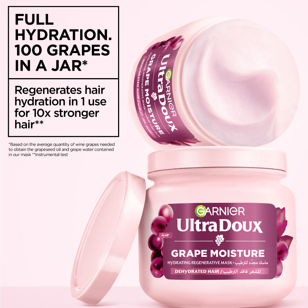 Garnier UltraDoux Grape Moisture hair mask jar with text highlighting hydration benefits on a pink background