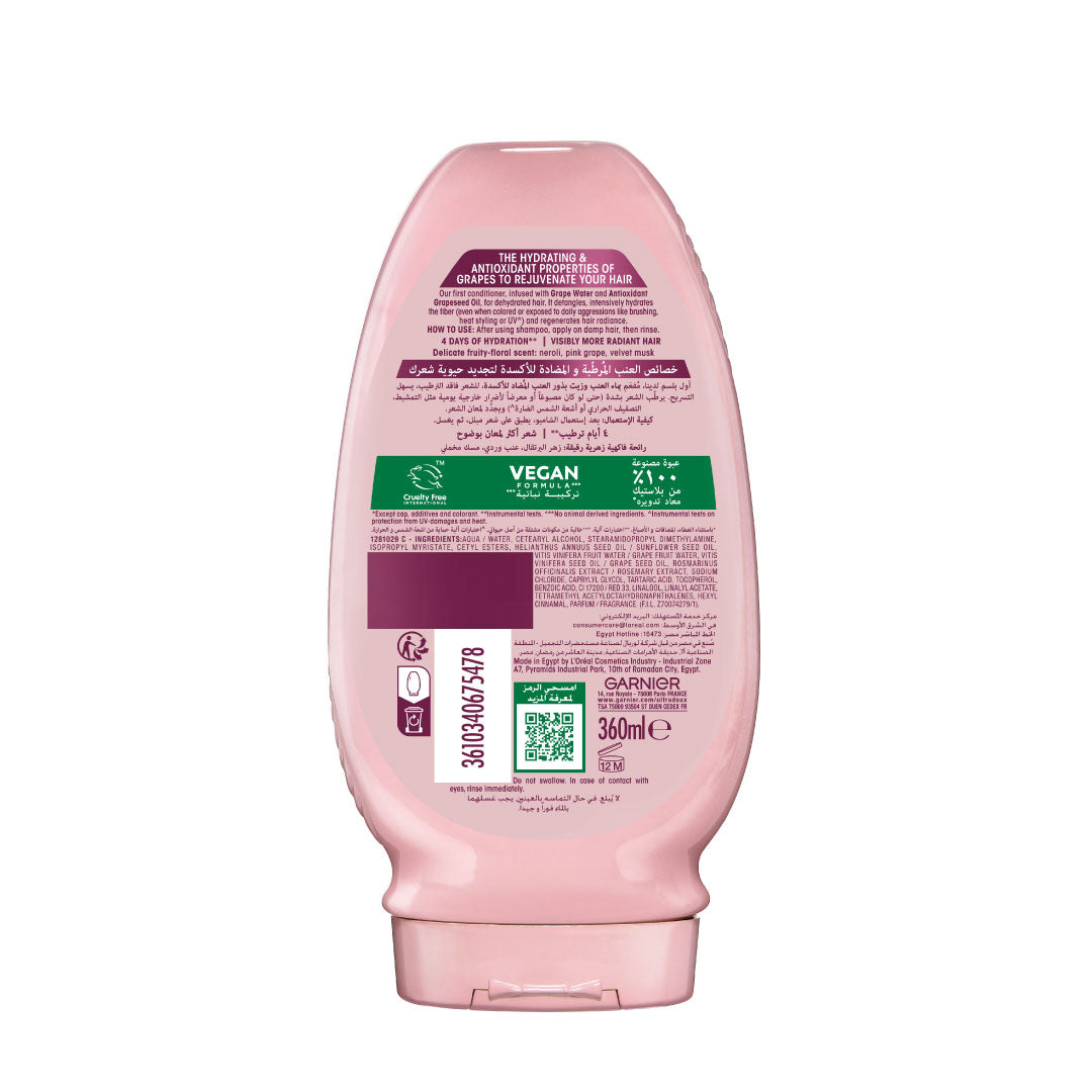 Garnier Ultra Doux Grape Moisture conditioner bottle with branding and sustainability information on a white background
