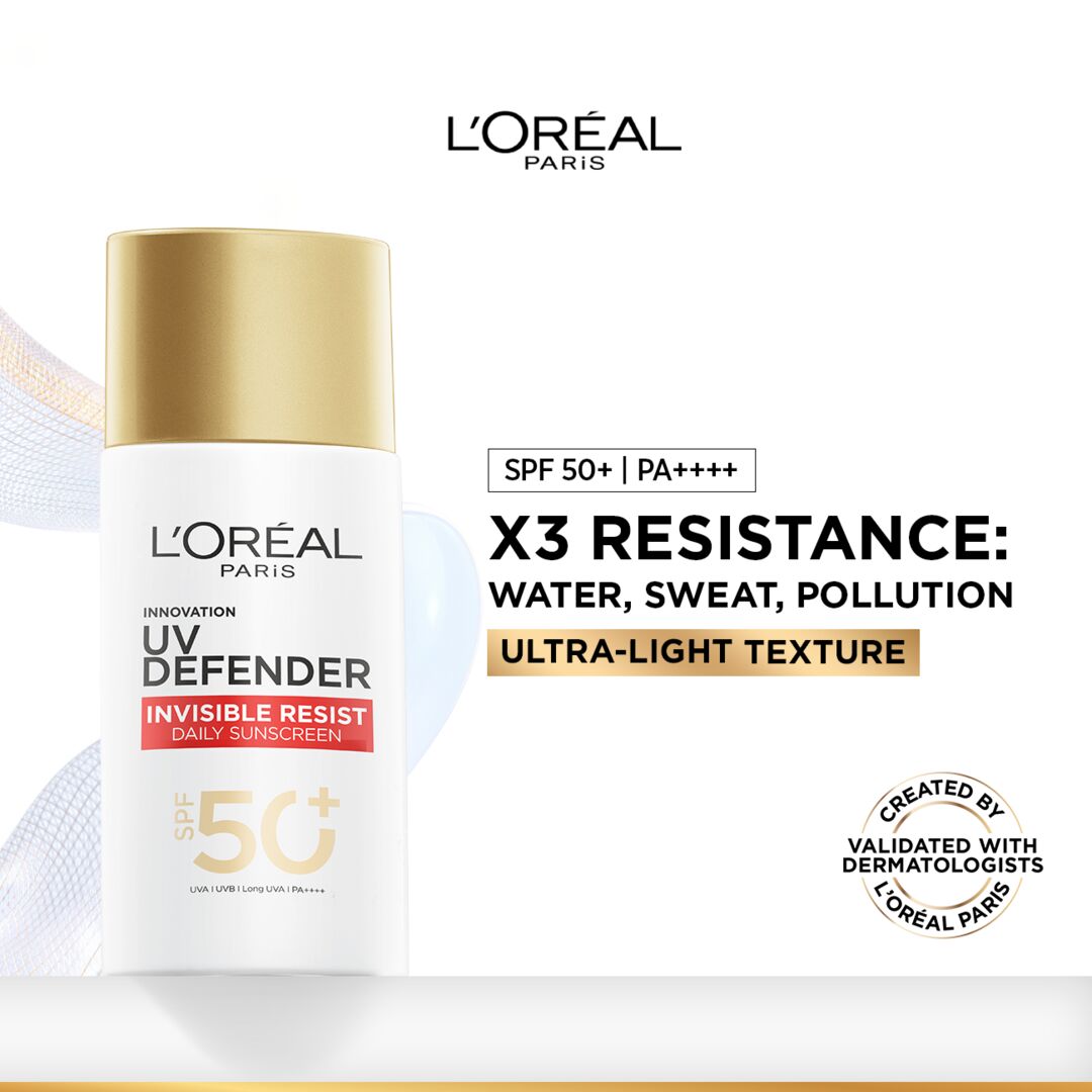 L'Oreal Paris UV Defender sunscreen bottle with branding and product features on a white background