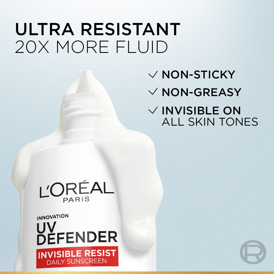 L'Oreal Paris UV Defender sunscreen bottle with product features on a light blue background